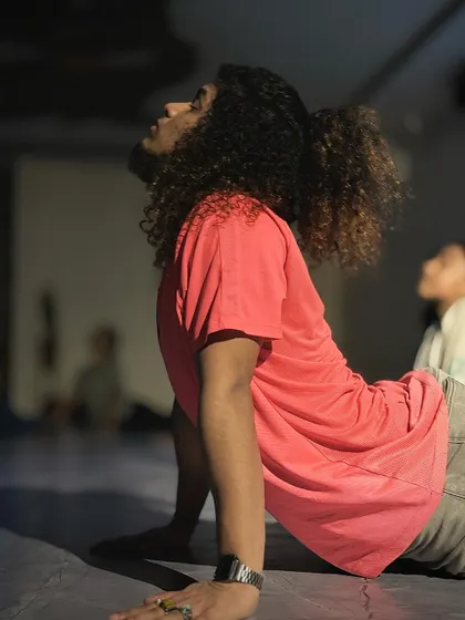 The upward-facing dog pose, perfectly executed by our instructor during a cool-down session. This pose helps open the chest and strengthen the spine.