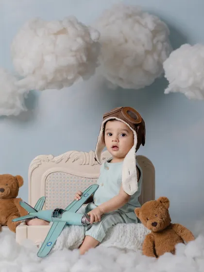Up in the clouds! A dreamy aviator-themed shoot with a baby pilot ready for takeoff.