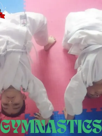 Gymnastics is part of our training to develop body awareness, flexibility, and strength. Here, students practice headstands to build core and shoulder stability.