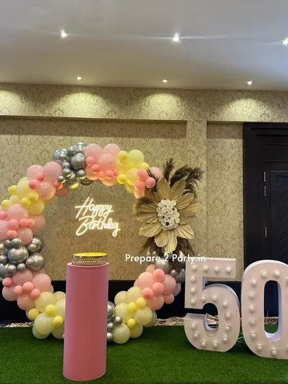 My 50th birthday decorations are designed to be tasteful and celebratory. I offer both floral-heavy designs and modern balloon arrangements to honor this golden milestone.