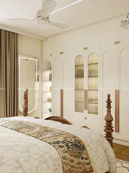 A classic and elegant bedroom with a four-poster bed and a full-wall wardrobe with arched glass doors. The design is timeless, sophisticated, and offers ample storage.