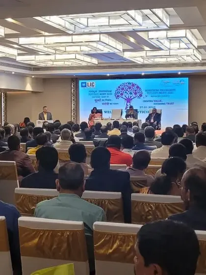 A wide-angle view of a packed conference hall for an LIC of India meeting, showcasing the scale of events we manage.