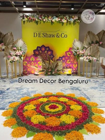 More Diwali vibes for a corporate client. This setup includes a custom backdrop with the company's name and a beautiful flower rangoli on the floor.