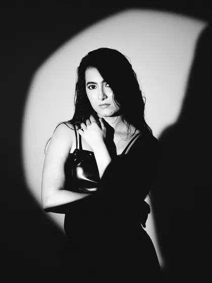 A direct look at the camera, framed by shadow. This black and white image is all about intensity and mood.