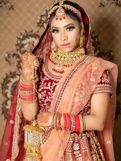 This bride showcases a full traditional look with a heavy choker, sheesh patti, and kalire. Every piece is available for rent to complete your dream bridal ensemble.