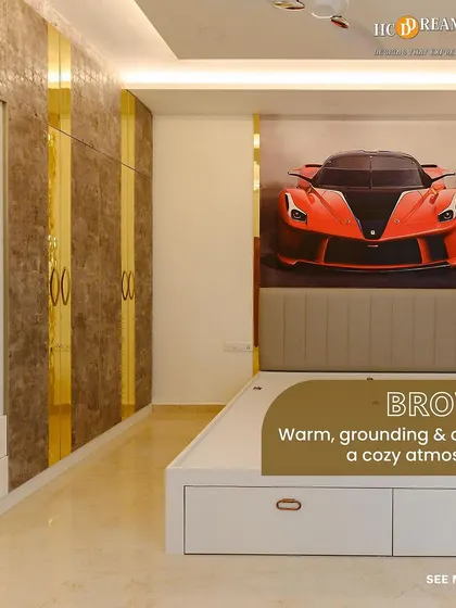 Another angle of the car-themed bedroom, showing the sleek white bed with under-drawer storage and the luxurious gold-striped wardrobe.
