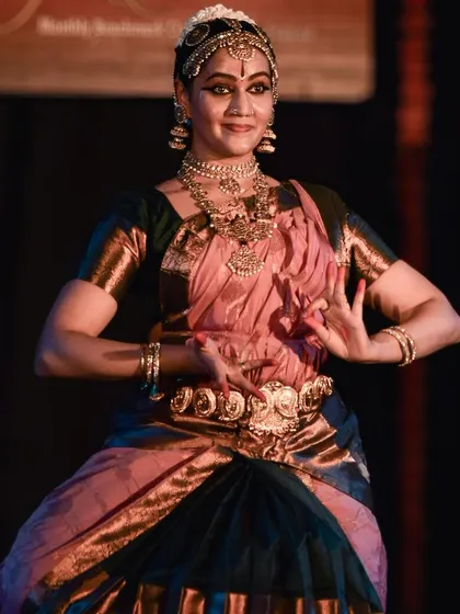 The dancer in a classic Bharatanatyam stance, a picture of perfect form.