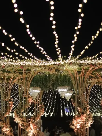 The grand mandap at night, with the fairy light canopy creating a breathtaking spectacle of light and shadow.