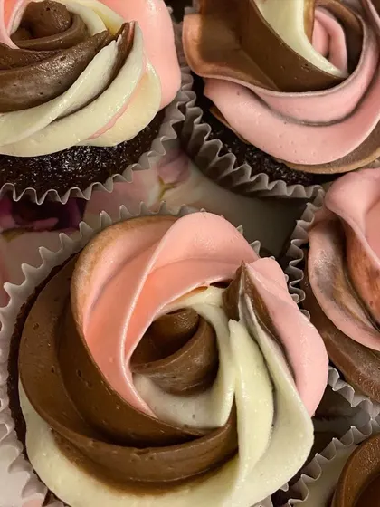 A close-up of my moist chocolate cupcakes with a beautiful tri-color swirl of frosting.