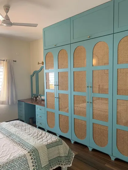 Teal out here stealing the show! This vintage-chic wardrobe combines a beautiful teal color with cane webbing and arched details for a truly unique look.