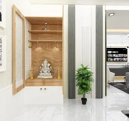 A close-up of a modern pooja unit with a wooden frame and frosted glass doors, blending traditional elements with contemporary aesthetics.
