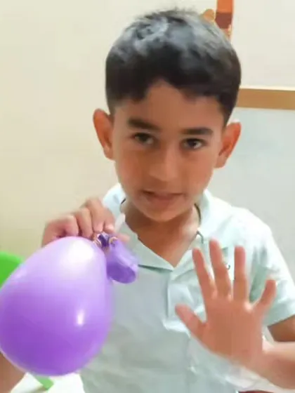 A close-up of a student explaining his lung model. I encourage kids to not only build but also explain what they've learned, reinforcing their understanding.