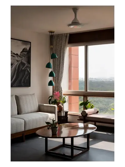 A quiet corner with a view, featuring a cascading pendant light and a comfortable daybed. These are the small, thoughtful spaces I love to create for relaxation.