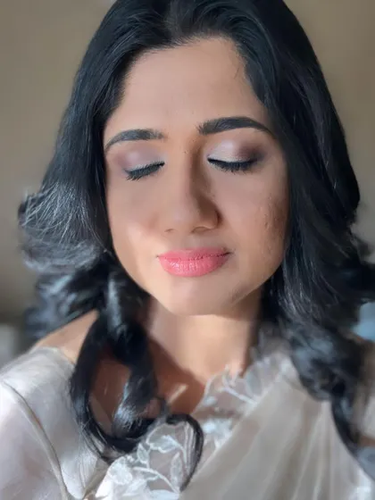 The soft curls and minimal makeup were the client's specific request for this daytime event, and she looked absolutely elegant.