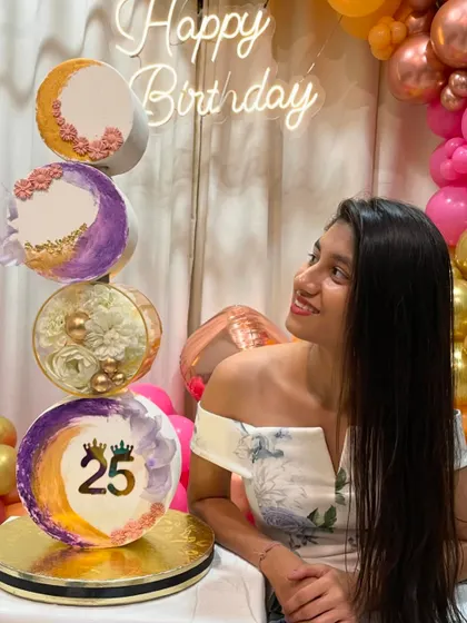 Another shot of me with my 25th birthday cake. The vertical design with different moon phases was a challenge I loved taking on.