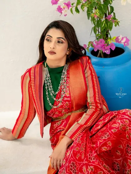 A close-up of Sonal's look, showcasing the beautiful diamond necklace and the unique combination of the saree, blouse, and jacket.