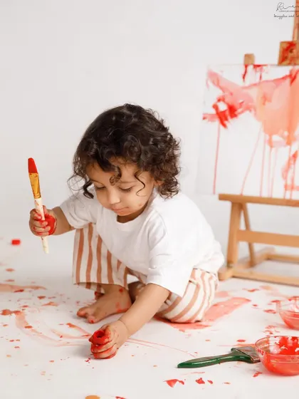 A painter in the making! A "paint smash" is a fun and creative alternative to a cake smash for a milestone birthday.