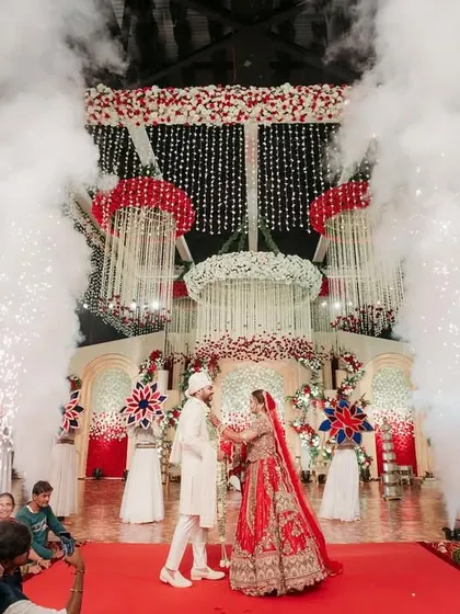 The moment of exchange, enhanced with dramatic smoke and cold pyro effects. I orchestrate these special effects to elevate the emotional peak of the ceremony.