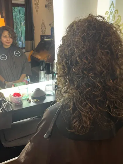 The before shot, showing the client's hair ready for a color and cut refresh.