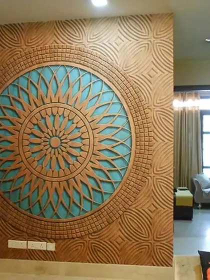 A stunning 3D carved mandala wall mural in terracotta and blue. This high-impact design creates an incredible sense of depth and artistry.