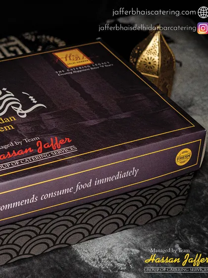 Another angle of our Premium Iftar Box, highlighting the "Ramadan Kareem" calligraphy and our contact details. We ensure every detail is perfect for your celebration.