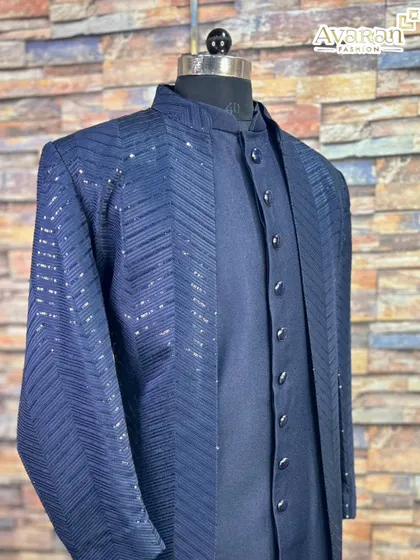 A closer look at the side of the navy blue Lakhnavi sherwani, emphasizing the detailed pattern and quality fabric.