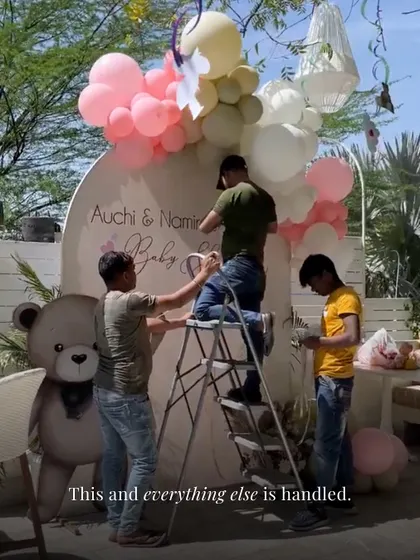 This and everything else is handled. A behind-the-scenes shot of my team setting up a beautiful teddy bear themed baby shower backdrop.