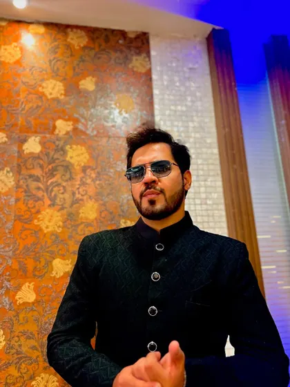 A suave look in a black bandhgala jacket, perfect for a formal reception or Sangeet night.