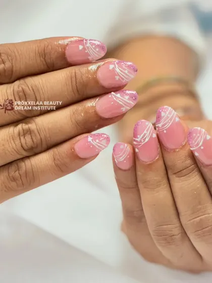 Another angle of the pink and white swirl design, showing the subtle glitter and the delicate line work.