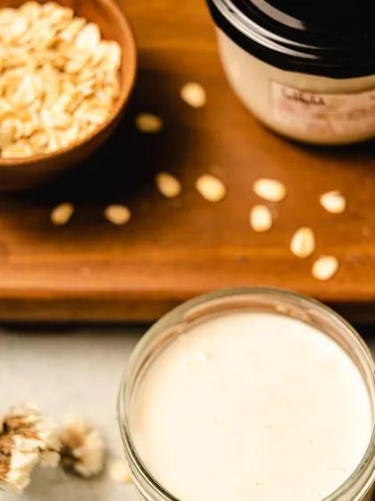 The ingredients for my 'Mohini' body yogurt. You can see the raw oats and the finished creamy product, showing the journey from natural ingredient to finished moisturizer.