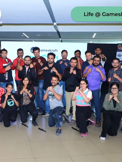 A group of empowered employees at Gameskraft. The fighting stance is more than a pose; it's a symbol of their newfound confidence and readiness.