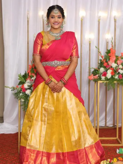 A duplicate of image 50, a full view of the client in her custom Langa Davani.
