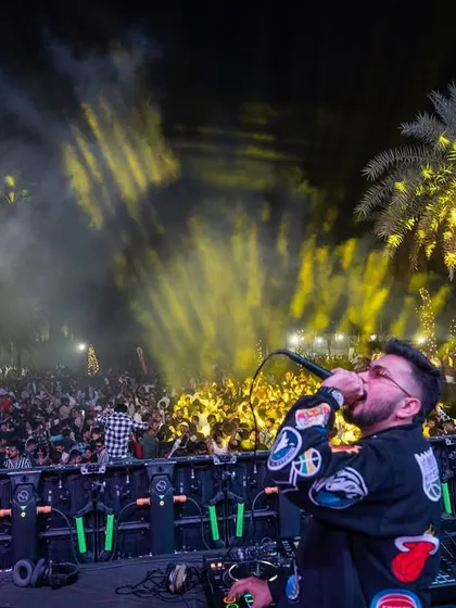 Me on the mic, with the crowd lit up and engaged. I feed off their energy, and they feed off mine.