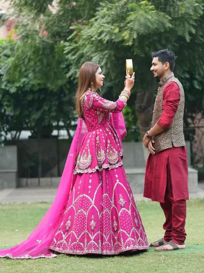 The iconic moment of a wife looking at her husband through the sieve on Karwa Chauth.
