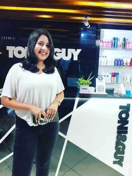 A happy client showing off her new haircut. We gave her a fresh, shoulder-length cut with soft layers and a gentle wave for a look that's both stylish and easy to maintain.
