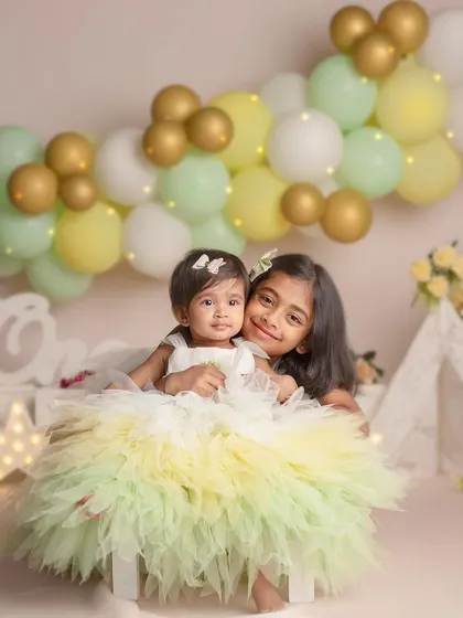 A repeat of the beautiful image 18, showing the tender hug between an older sister and her baby sibling, a perfect example of the love I aim to capture.