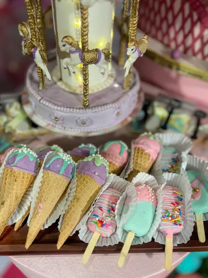 To complete the carnival experience, I made these fun cakesicles designed to look like ice cream cones and popsicles, decorated with pastel colours and sprinkles. They were a huge hit with the kids.