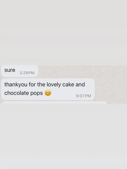 "thankyou for the lovely cake and chocolate pops." A happy client review for the two-tier cat theme cake.
