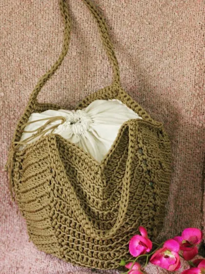 The finished chevron tote bag with its unique drawstring closure. A perfect blend of style and function.