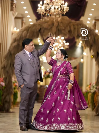 Celebrating 25 years of love, this couple shares a dance during their silver jubilee anniversary party, proving that beautiful moments are worth capturing at every stage of life.