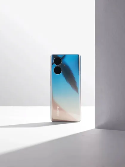 The realme 10 Pro+ 5G shot with hard light and shadows, creating a clean, architectural look.