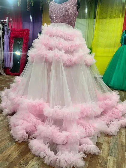 Another angle of our pink and white ruffle gown, showing its impressive volume and trail.