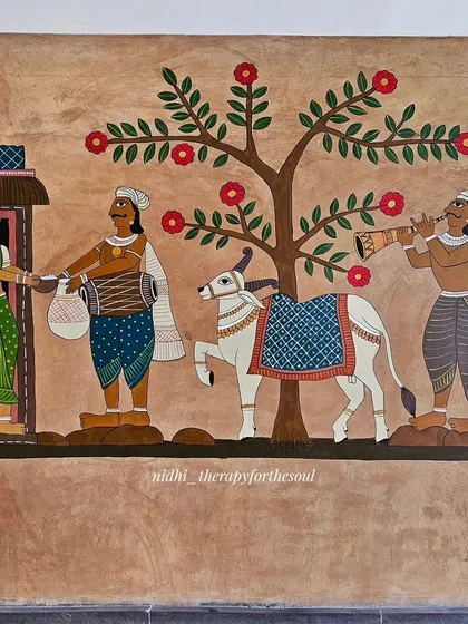 This part of the mural depicts a traditional 'bhikshe' (alms) scene, with a decorated 'basava' (bull) and musicians, bringing a cultural procession to life.