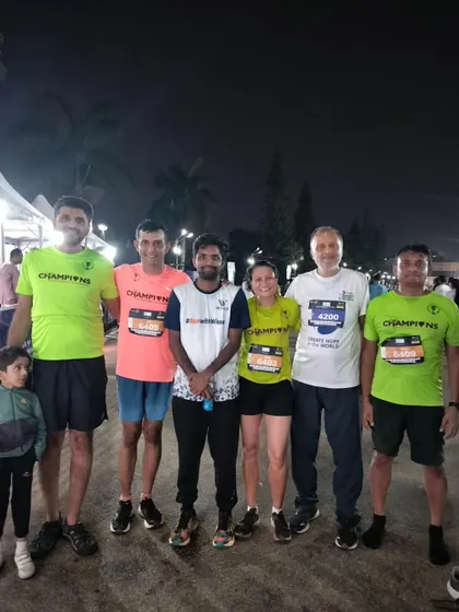 The team at the Bengaluru Midnight Marathon. Running at night brings a different kind of energy and challenge, and we were ready for it.