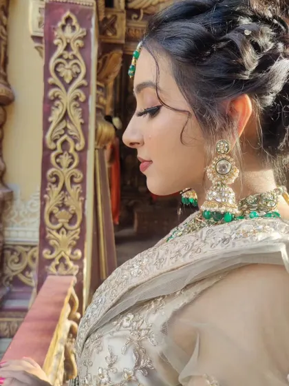 A profile view highlighting the contour, eye makeup, and hairstyle details. Every angle is considered to ensure the final look is cohesive and photographs beautifully.