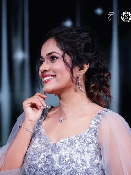A close-up of Sayli Kamble's happy smile. It is a pleasure to provide beautiful jewelry that makes our clients feel special and confident.