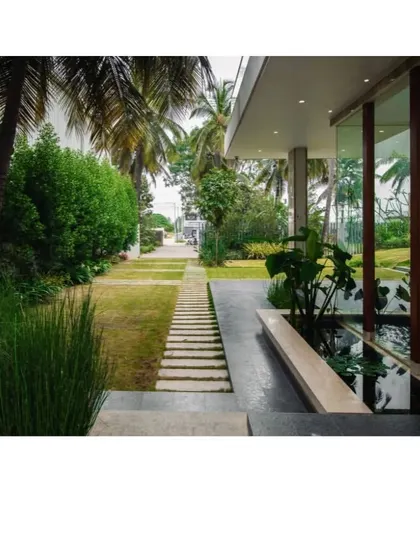 Where architecture meets tranquility. A seamless blend of nature and design, this pathway with a water feature leads you on a journey into serenity.