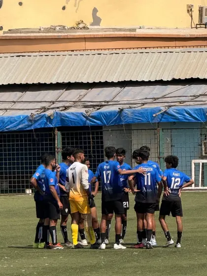 A pre-game huddle, where the coach gives final instructions to the team.