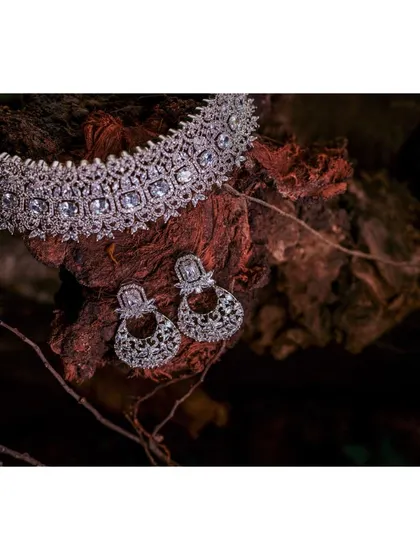 A beautiful detail shot of the bride's diamond necklace and earrings, showcasing the stunning jewelry chosen for the day.