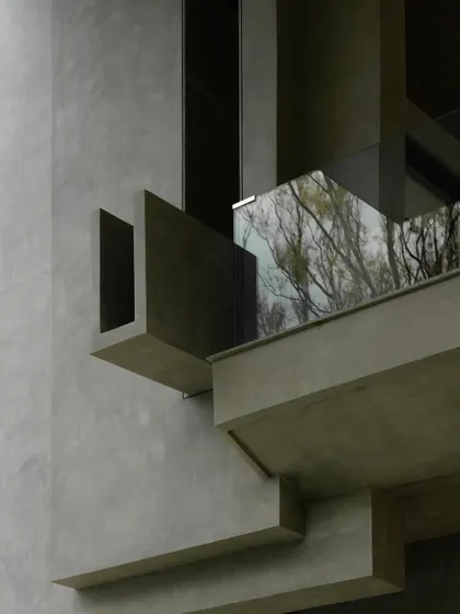 Close-up details of the concrete facade, showing the interplay of sharp angles, deep recesses, and smooth surfaces. These shots emphasize the building's sculptural and tactile qualities.